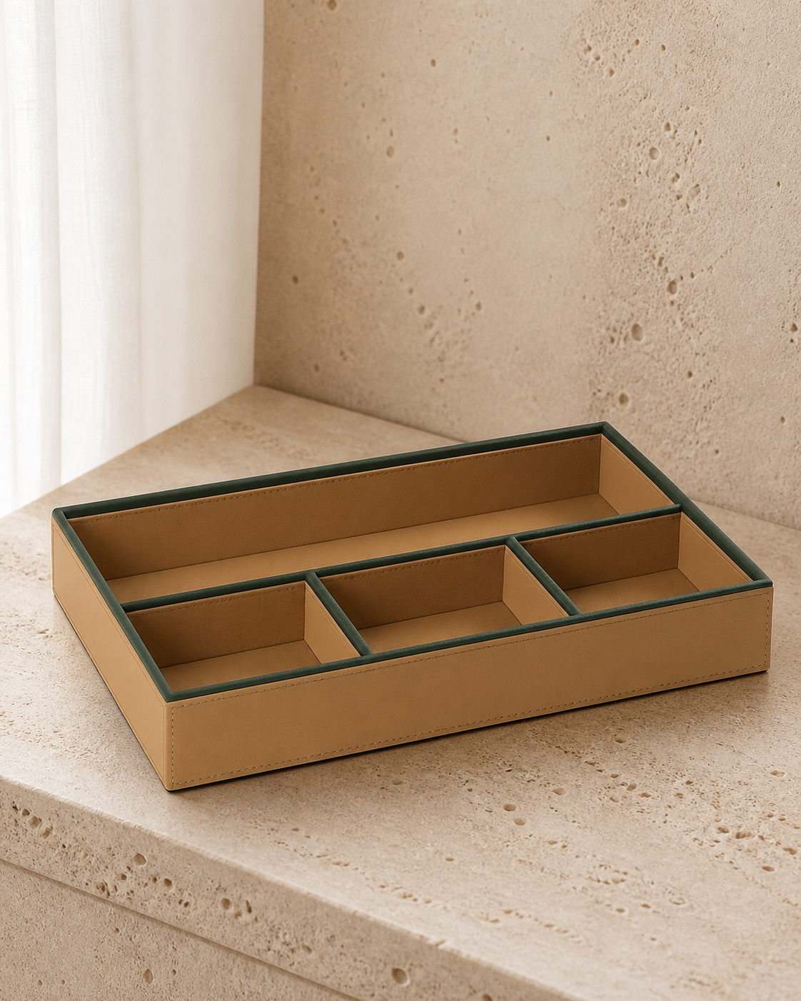 Beige compartment tray with green piping, 4 compartments, grounded editorial view