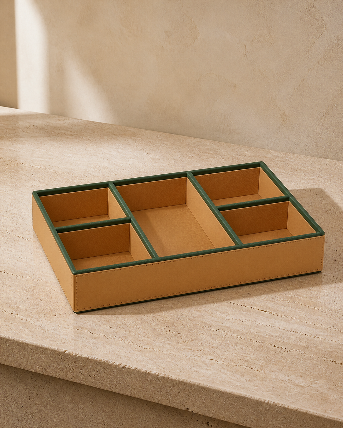 Beige compartment tray with green piping, 5 compartments, grounded editorial view