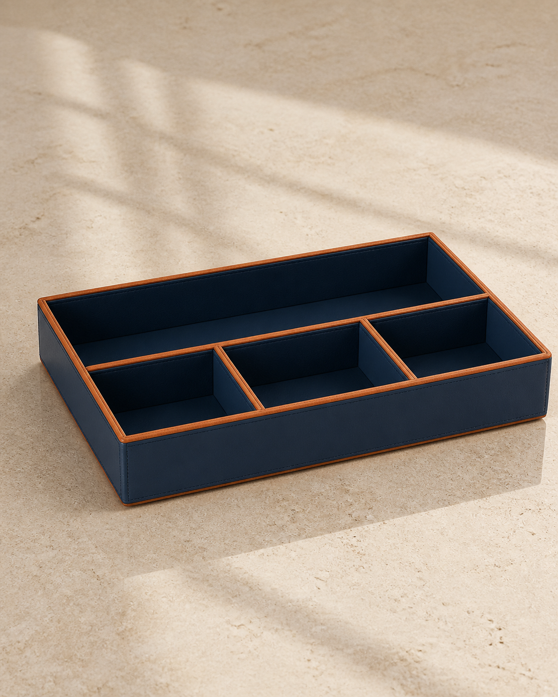 Blue compartment tray with orange piping, 4 compartments, grounded editorial view