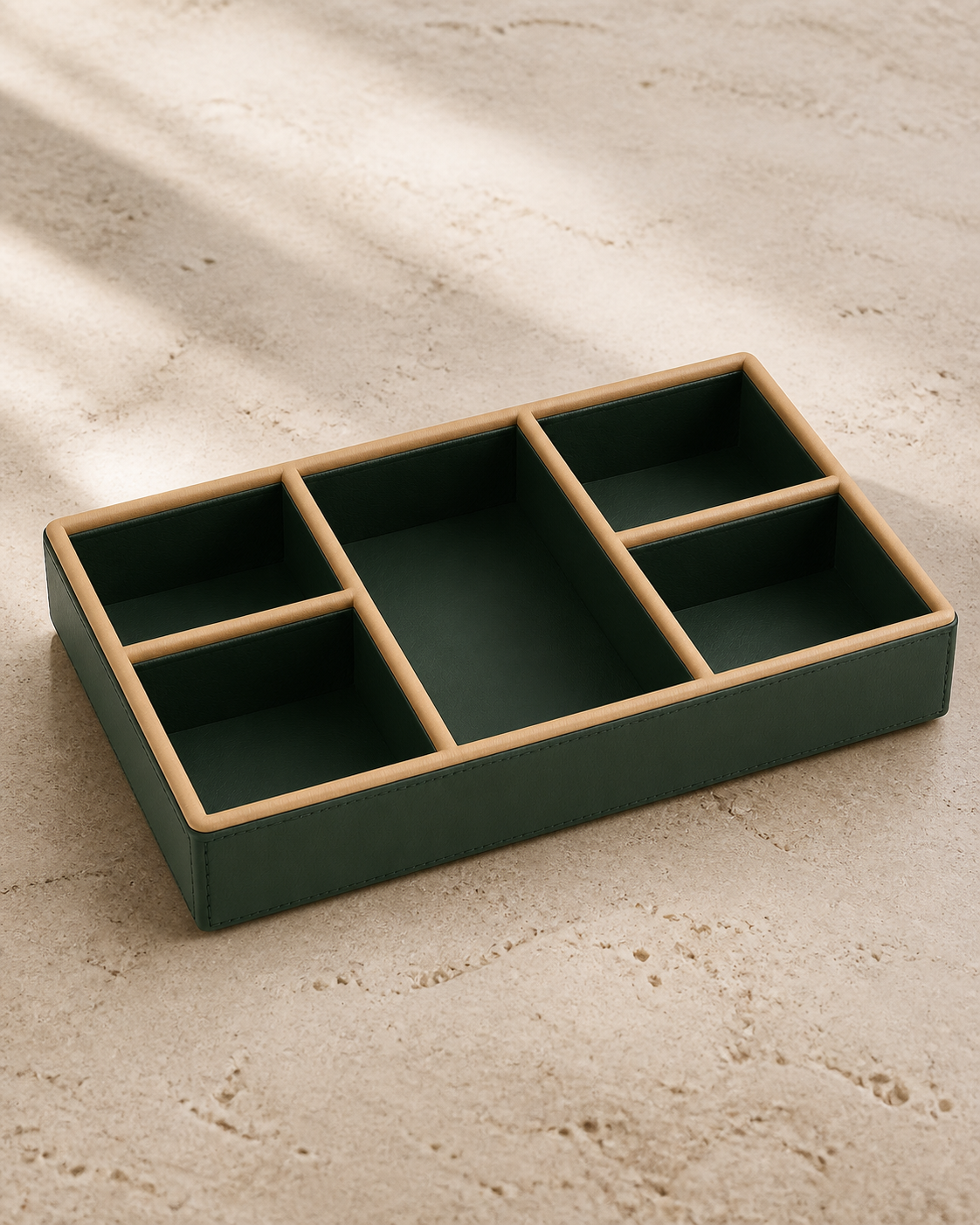 Green compartment tray with beige piping, 5 compartments, grounded editorial view