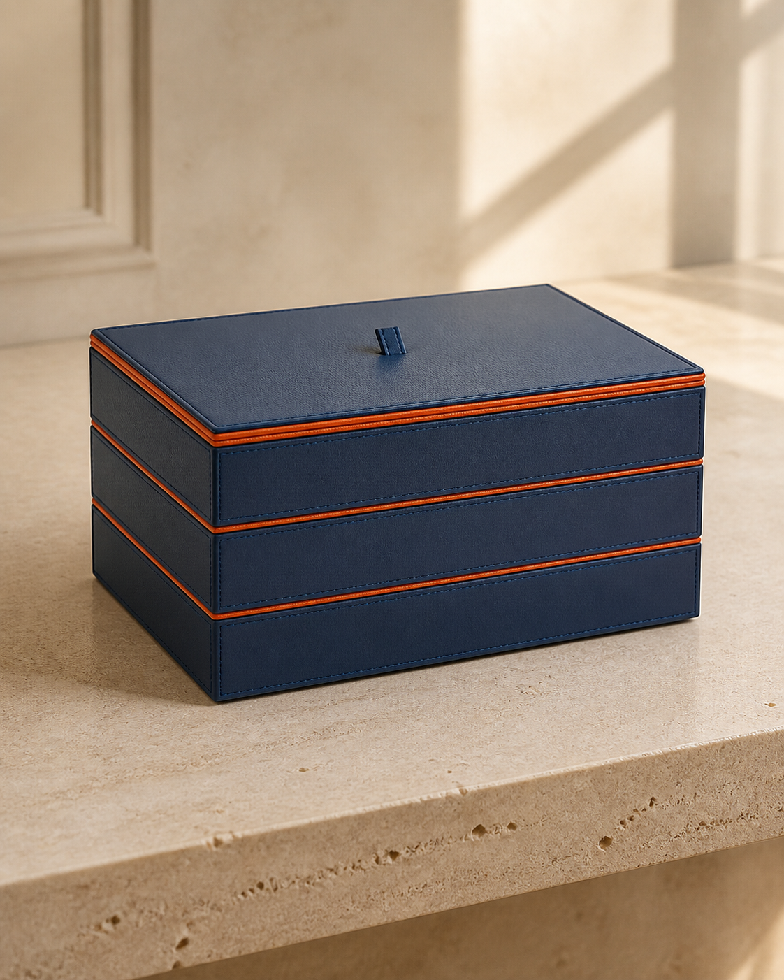 Lidded Stack Tray set of three in Blue with orange piping, grounded editorial view