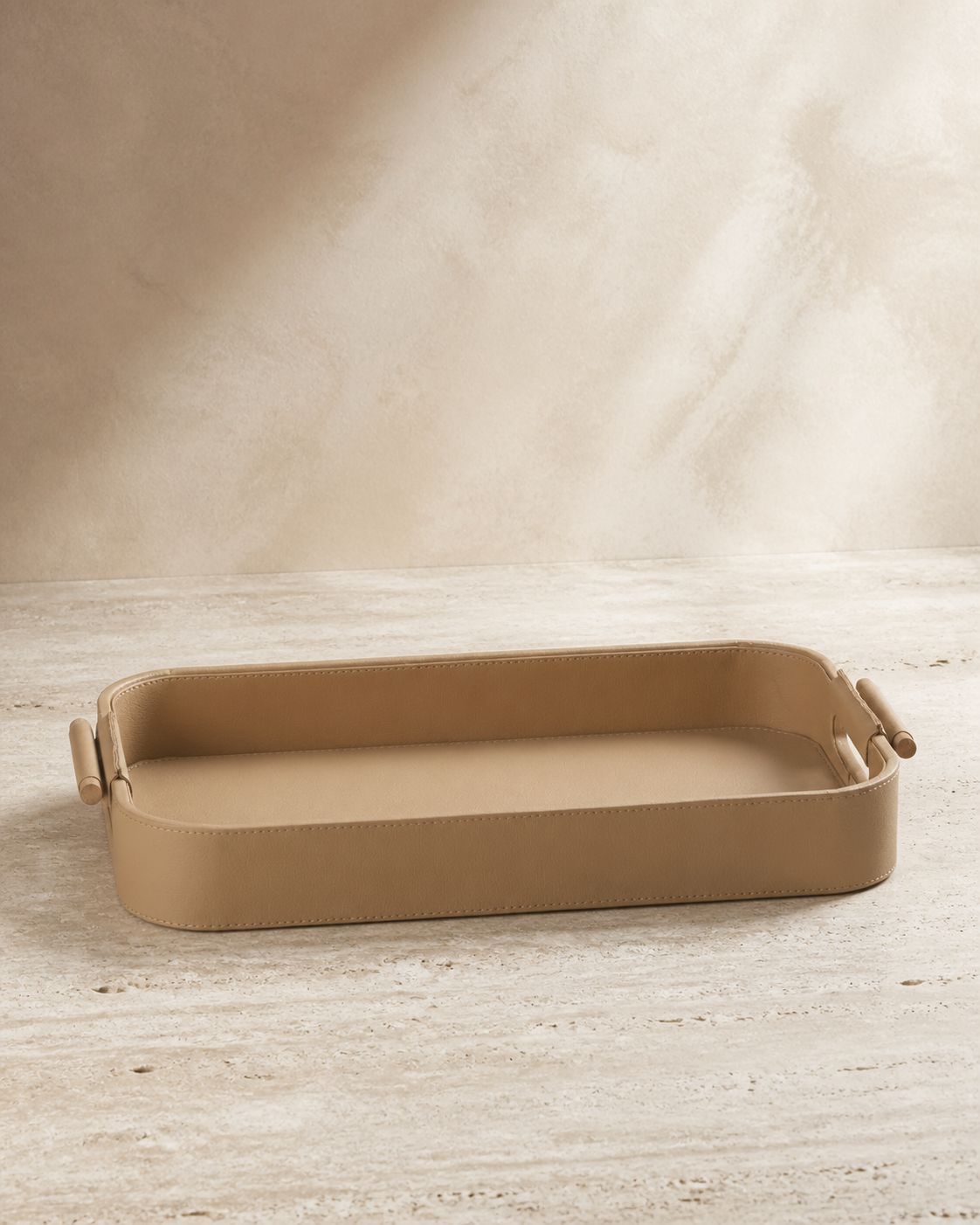 Beige serving tray with wooden handles, grounded editorial product view
