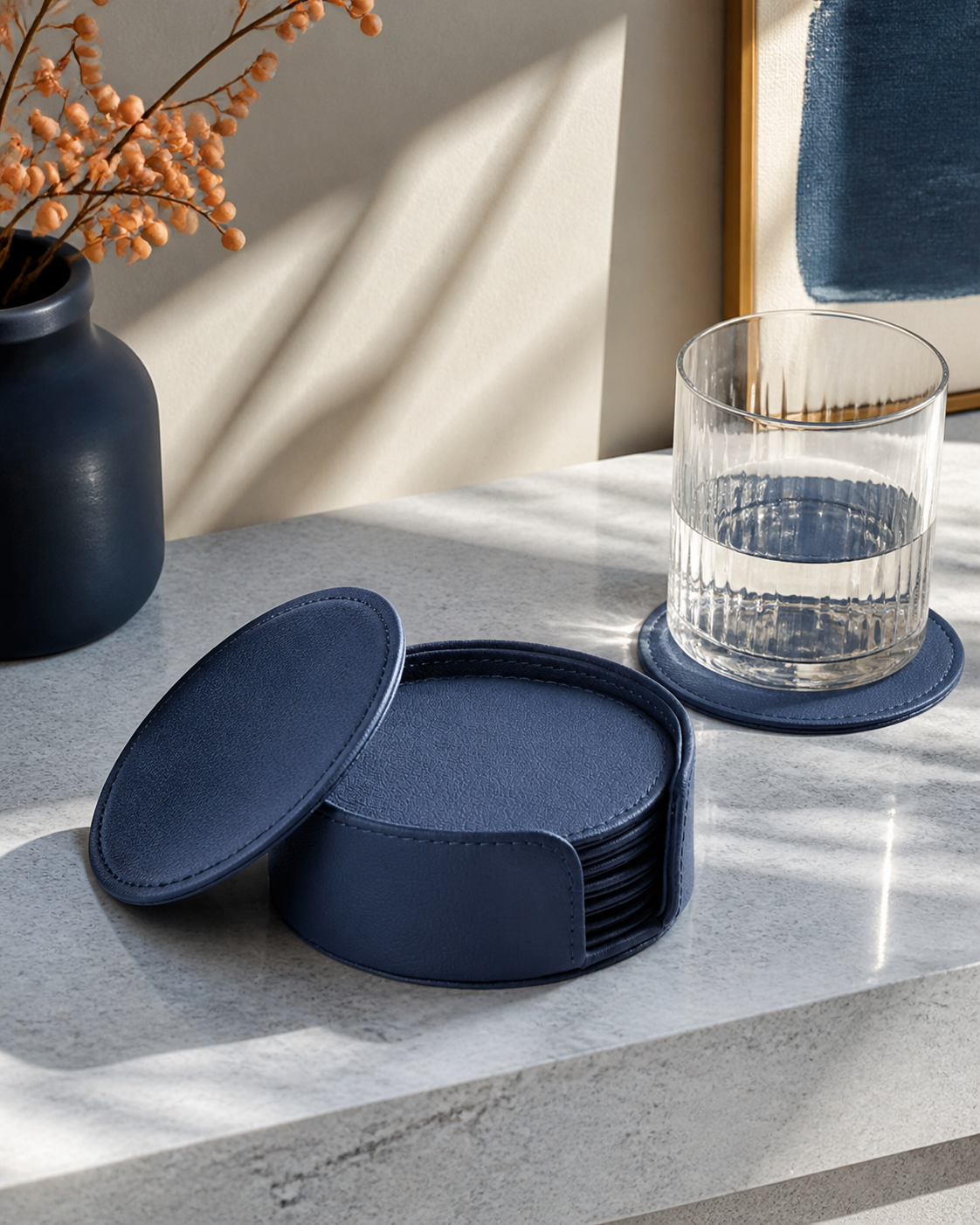 Blue faux-leather coaster set, six round coasters in stitched holder