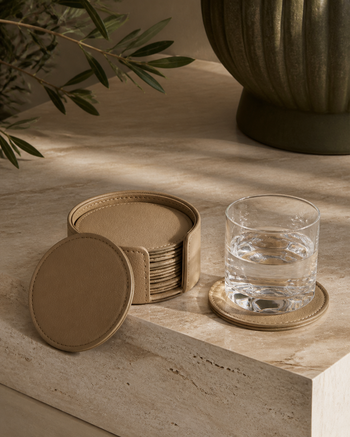 Beige faux-leather coaster set, six round coasters in stitched holder