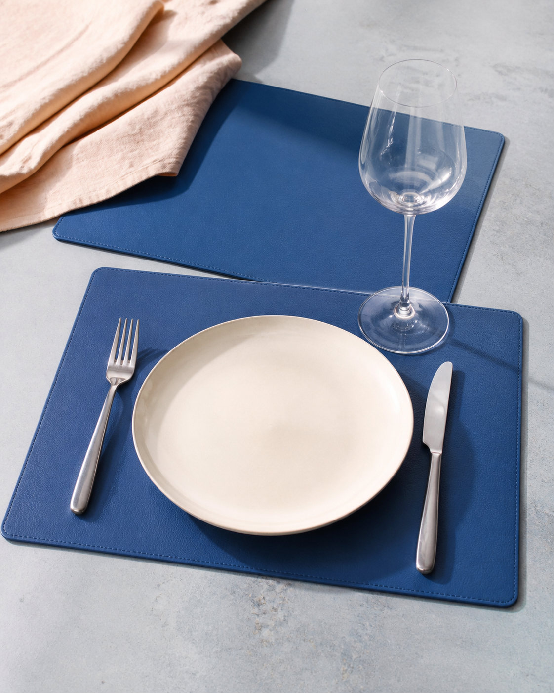 Blue faux-leather rectangular placemat editorial setting