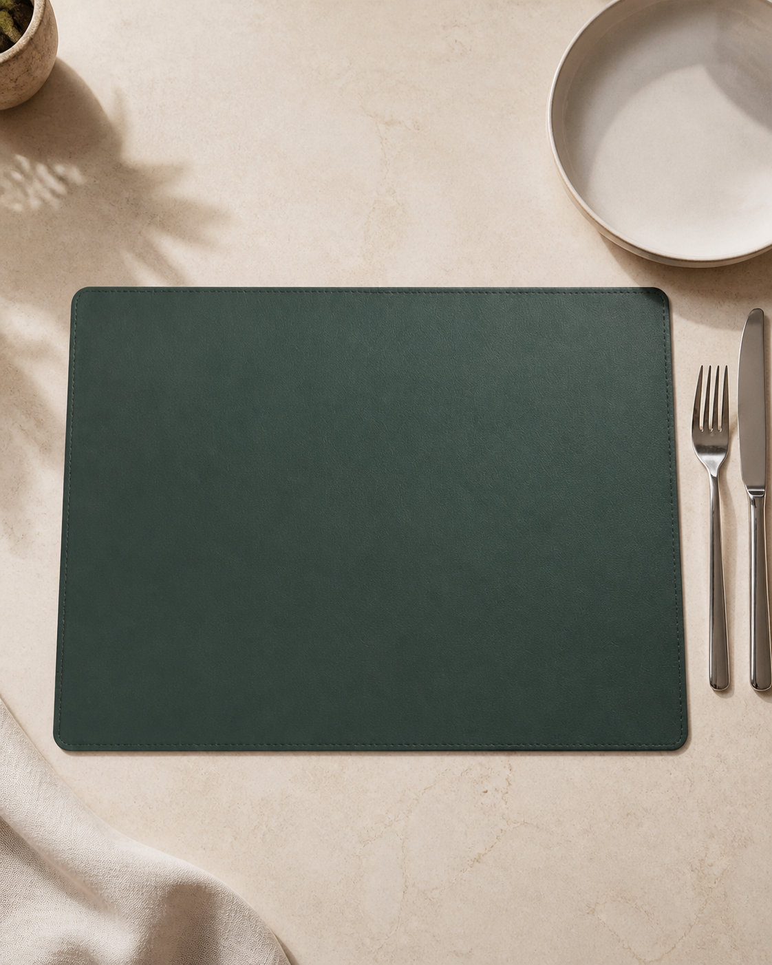 Casa Botanical Sage Green faux-leather placemat, exact 16 by 12 inch editorial view