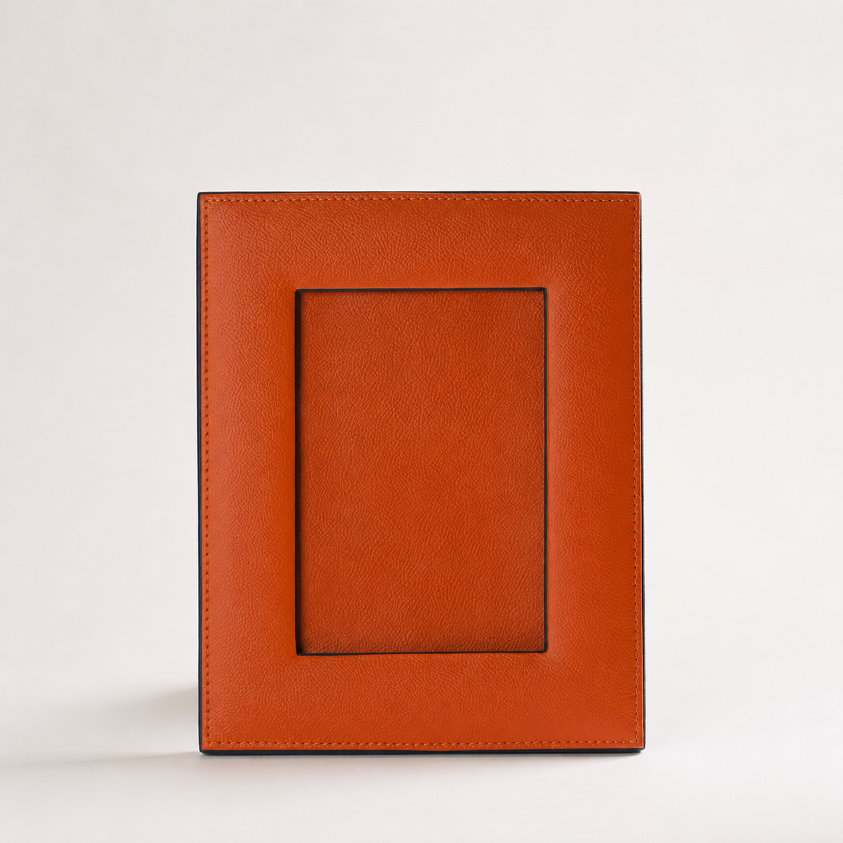 Faux-Leather Photo Frame in Mellow Apricot — clean studio hero